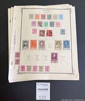 Stack of cream-colored album pages showing full pages of Belgium postage stamps arranged by denomination and design, mostly used with postal cancellations visible.