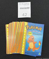 Front view of multiple Charmander cards in the set showing the front artwork and numbering