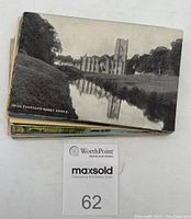 Stack of postcards topped with black and white Fountains Abbey card