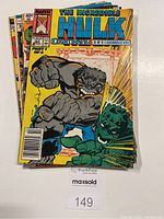 Group photo of 5 Incredible Hulk comic books with visible covers, stacked with the December 1989 issue on top.