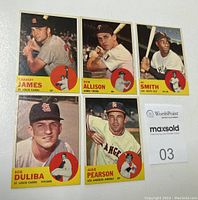 Photo of all five 1963 Topps baseball cards showing front faces including Albie Pearson, Al Smith, Bob Allison, Bob Duliba, Charley James.