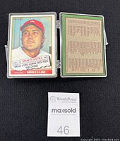 Front and back of a 1975 Topps Sports Extra baseball card featuring Mike Lum, with player portrait and text information for the date and event.