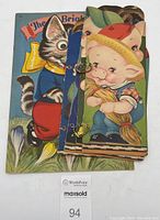 Two vintage children's storybooks stacked, colorful covers visible showing character illustrations.