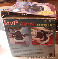 Photo showing the MVP buffer/polisher in its original box, highlighting the product on the packaging including the 10-inch pad and 120 volt power rating.
