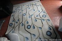Rug laid out on floor showing full pattern and colors