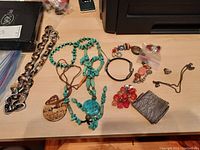 Full lot showing all jewelry items spread out on a table