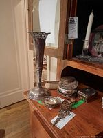 Two sterling silver vases (13" and 8" tall), small silver bowl lid, vanity brush, small silver dish, ornate scissors, pierced napkin ring