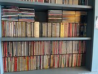 Shelf view showing two rows of compact discs