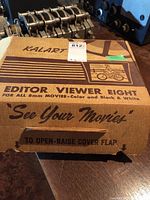 Vintage Kalart Editor Viewer Eight original box top with text and graphic of a woman on a bicycle.