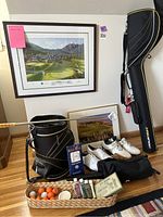 Overall view showing both framed prints, golf bag, club, shoes, glove and basket of balls