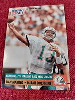 Front image of Dan Marino NFL Pro Set football card featuring milestone of 7th straight 3,000-yard season.