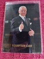 Clear image of a Don Cherry redemption card depicting Don Cherry giving a thumbs up, with a dark background and gold text at the bottom.