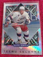 Hockey trading card showing Teemu Selanne in white Winnipeg Jets uniform with holographic detail