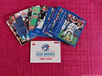 Collection of 42 Toronto Blue Jays baseball cards from Donruss and McDonald's covering years 1985-1992, plus one white labeled storage box