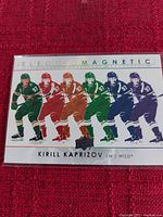 Photo of the Upper Deck Electro Magnetic Kirill Kaprizov Minnesota Wild hockey card showing multiple colored images of the player.