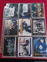 Nine hockey cards displayed in a 3x3 plastic sleeve page, featuring Felix Potvin mostly in Toronto Maple Leafs uniform.
