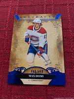Hockey card showing Max Domi in Canadiens uniform, serial numbered 148 out of 499.