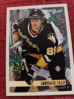 Hockey trading card showing Jaromir Jagr in Pittsburgh Penguins uniform with holographic background.