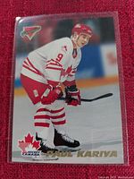 Front image of a Paul Kariya hockey card from the Premier Hockey Canada series displaying the player in Team Canada gear on the ice.