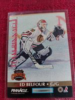 Front of the hockey trading card showing Ed Belfour in goalie gear with Team Pinnacle branding and Clarence Campbell Conference logo.