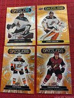 Photo showing four Upper Deck Dazzlers hockey cards featuring Karel Vejmelka, John Gibson, Cam Fowler, and Clayton Keller.