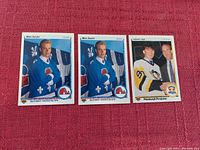 Photo showing three Upper Deck hockey cards from 1990/1991: two Mats Sundin cards in Quebec Nordiques uniform and one Jaromir Jagr card in Pittsburgh Penguins uniform.