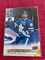 Front image of Upper Deck UD Canvas hockey card featuring John Tavares in Toronto Maple Leafs uniform.