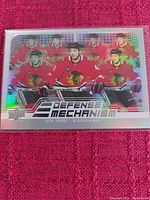 Hockey trading card glossy holographic with Seth Jones images in Chicago Blackhawks jersey and Defense Mechanism branding