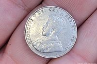 Obverse side of the 1935 Canadian 5 cent nickel coin showing King George V portrait and inscription.