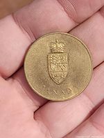 Front of the Canada Centennial Commemorative Medal showing crowned shield and CANADA text.
