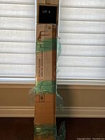 Side view of tall box packaging for the Elora Gazebo, showing seal wrap and labeling.