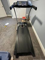Full front view of LifeSpan treadmill showing running belt, handles, and control panel