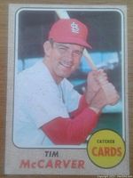 Front of 1968 Topps Tim McCarver baseball card showing player in St. Louis Cardinals uniform with bat.