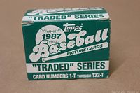 Front of the original green and white 1987 Topps Baseball 'Traded' Series card box displaying series branding and card numbering range 1-T through 132-T.