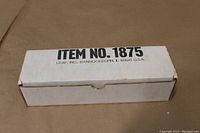 Closed white cardboard box labeled ITEM NO. 1875 from Leaf, Inc. showing packaging of the sealed card set.