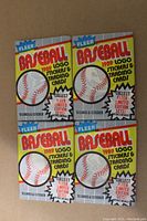 Front view of four unopened 1989 Fleer Baseball wax packs showing branding and pack details.