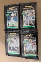 Four sealed foil packs of 1993 Pinnacle Series 2 baseball cards laid out showing front of packs with player photos and branding.