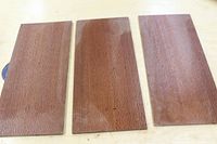 Three rectangular lacewood veneer pieces laid side by side showing uniform size and finish