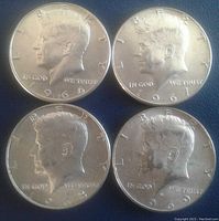 Obverse sides of four Kennedy half dollars from 1966, 1967, 1968, and 1969 showing Kennedy's profile and dates.