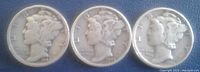 Obverse side of three Winged Mercury dimes showing Liberty with winged cap and visible dates 1942, 1943, and 1944.