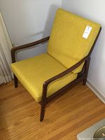 Front three-quarter view showing overall frame design and cushion condition