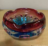 Photo of Murano glass ashtray showing side profile with gradient color from red to blue and clear base