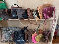 Image showing 14 handbags arranged on shelves and floor, various colors and materials visible.