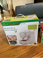 Box of Lil Sew & Sew mini sewing machine by Tivax showing front and some product features.