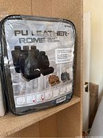 Packaged PU leather Rome car seat covers in black.