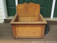 Full view of the rectangular birds eye figured maple storage box showing sides and top interior.