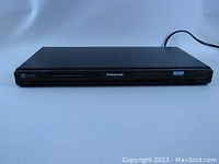 Front view of Panasonic DVD player showing slim black design and disc tray.