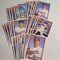 28 Topps 1991 Texas Rangers baseball cards arranged in fan shape, showing player images and Topps 40 Years of Baseball logo.