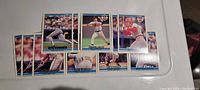 Photo of 11 1992 Donruss baseball cards laid out on a white surface featuring several well-known players including Ryne Sandberg, Tom Glavine, Chris Sabo, Andre Dawson, Tony Gwynn, Will Clark, and Bobby Bonilla.