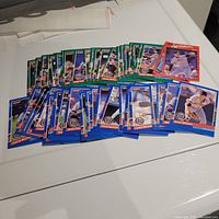 Photo showing over 40 1991 Donruss Detroit Tigers baseball cards laid out in rows on a white surface. Cards depict various players in action poses with the classic red and blue Donruss border.